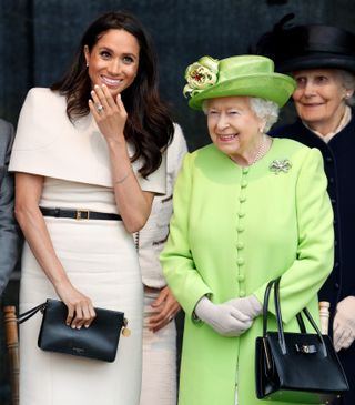 WIDNES, UNITED KINGDOM - JUNE 14: (EMBARGOED FOR PUBLICATION IN UK NEWSPAPERS UNTIL 24 HOURS AFTER CREATE DATE AND TIME) Meghan, Duchess of Sussex and Queen Elizabeth II attend a ceremony to open the new Mersey Gateway Bridge on June 14, 2018 in Widnes, England. Meghan Markle married Prince Harry last month to become The Duchess of Sussex and this is her first engagement with the Queen. During the visit the pair will open a road bridge in Widnes and visit The Storyhouse and Town Hall in Chester. (Photo by Max Mumby/Indigo/Getty Images)