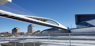 A futuristic-looking pedestrian bridge. It resembles a high-speed train's aerodynamic shape.