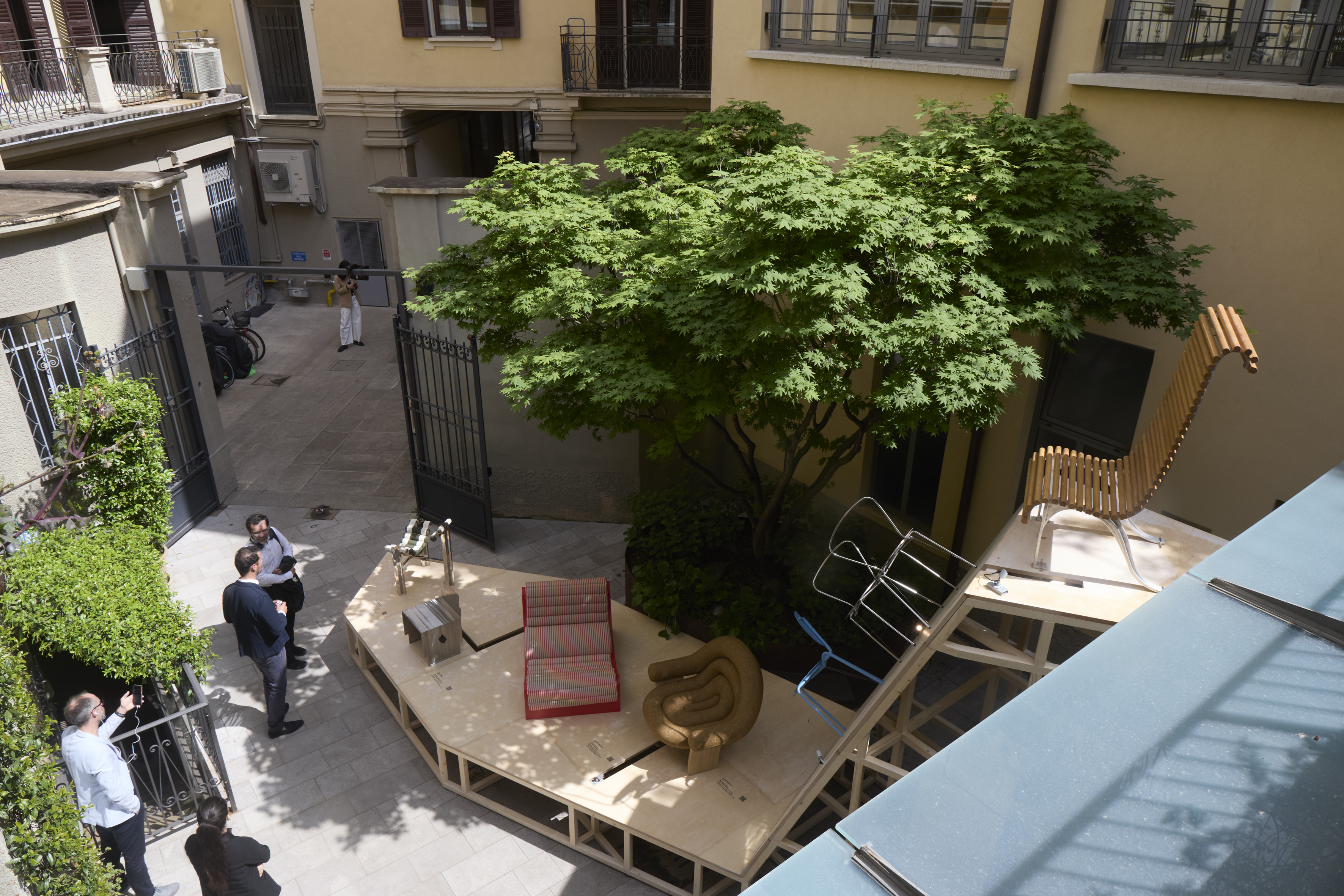 furniture and lighting displayed on timber platform