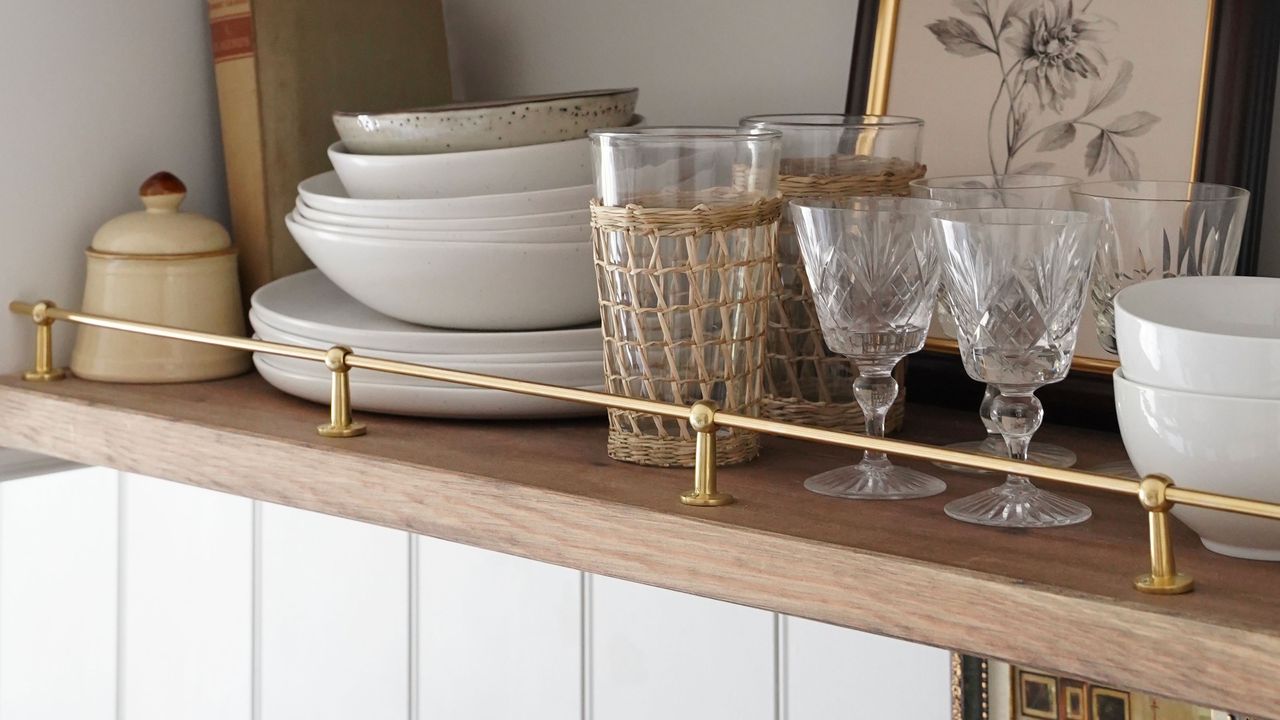 Kitchen shelves with a brass riser rail