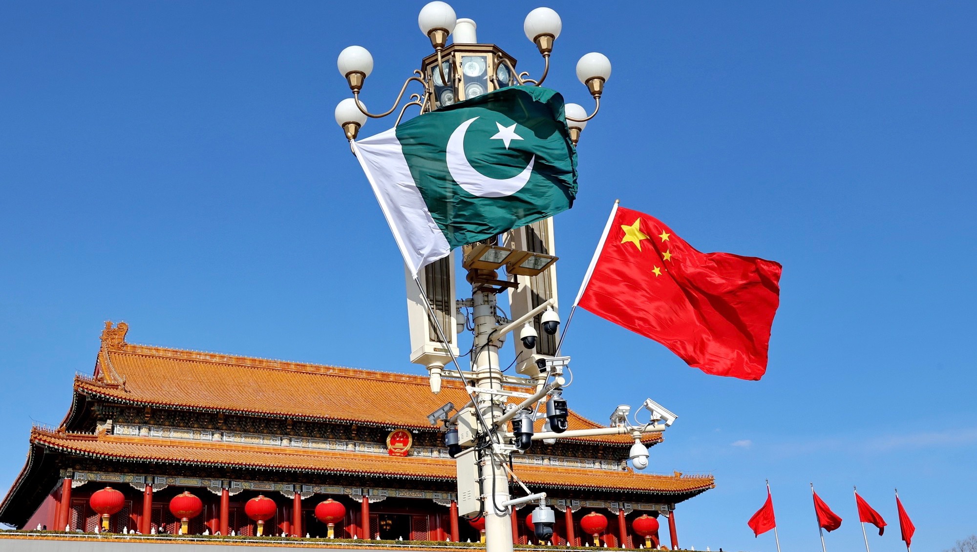 Image of Pakistani and Chinese flags flying alongside one another