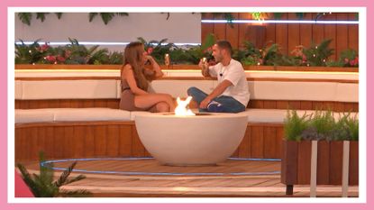 two love Island contestants, Ron and Tanyel, sitting around the fire pit with a drink