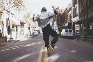 adobe certification: Man jumping for joy