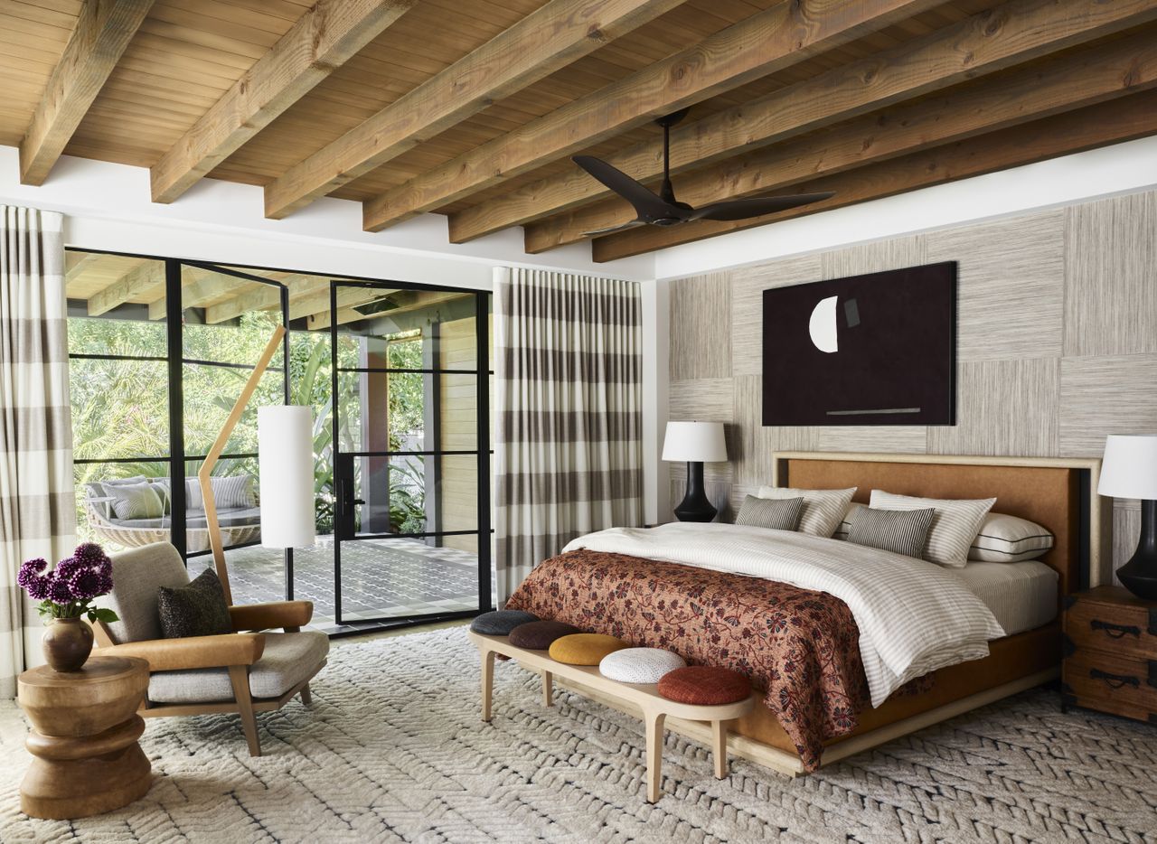 A large bedroom with an oversized rug