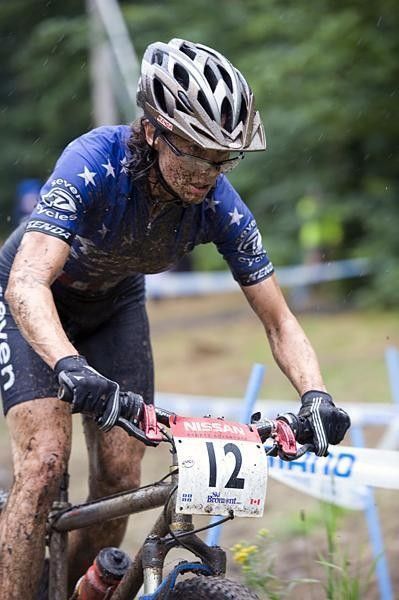 Mary McConneloug looks over the top of a pair of muddy glasses