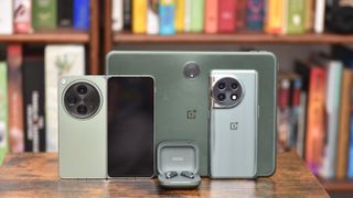 OnePlus Open with OnePlus 11, OnePlus Pad, and OnePlus Buds Pro 2 all in matching green
