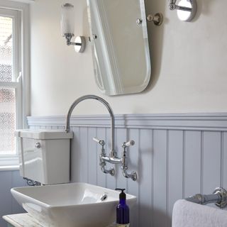 A bathroom with wall panelling