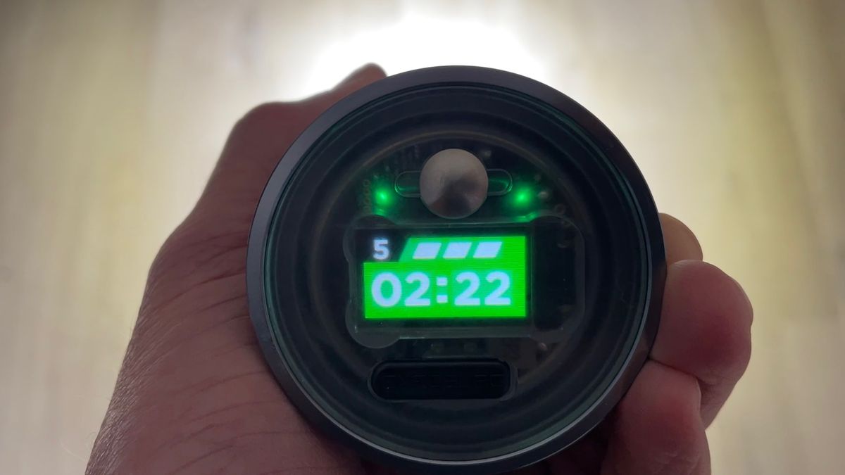 An Exposure Six Pack 15 MTB light with detail of the rear battery status/mode screen