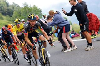 Team Jumbo Vismas Sepp Kuss of US rides ahead of Team UAE Emirates Tadej Pogacar of Slovenia wearing the overall leaders yellow jersey during the 18th stage of the 108th edition of the Tour de France cycling race 129 km between Pau and Luz Ardiden on July 15 2021 Photo by Thomas SAMSON AFP Photo by THOMAS SAMSONAFP via Getty Images