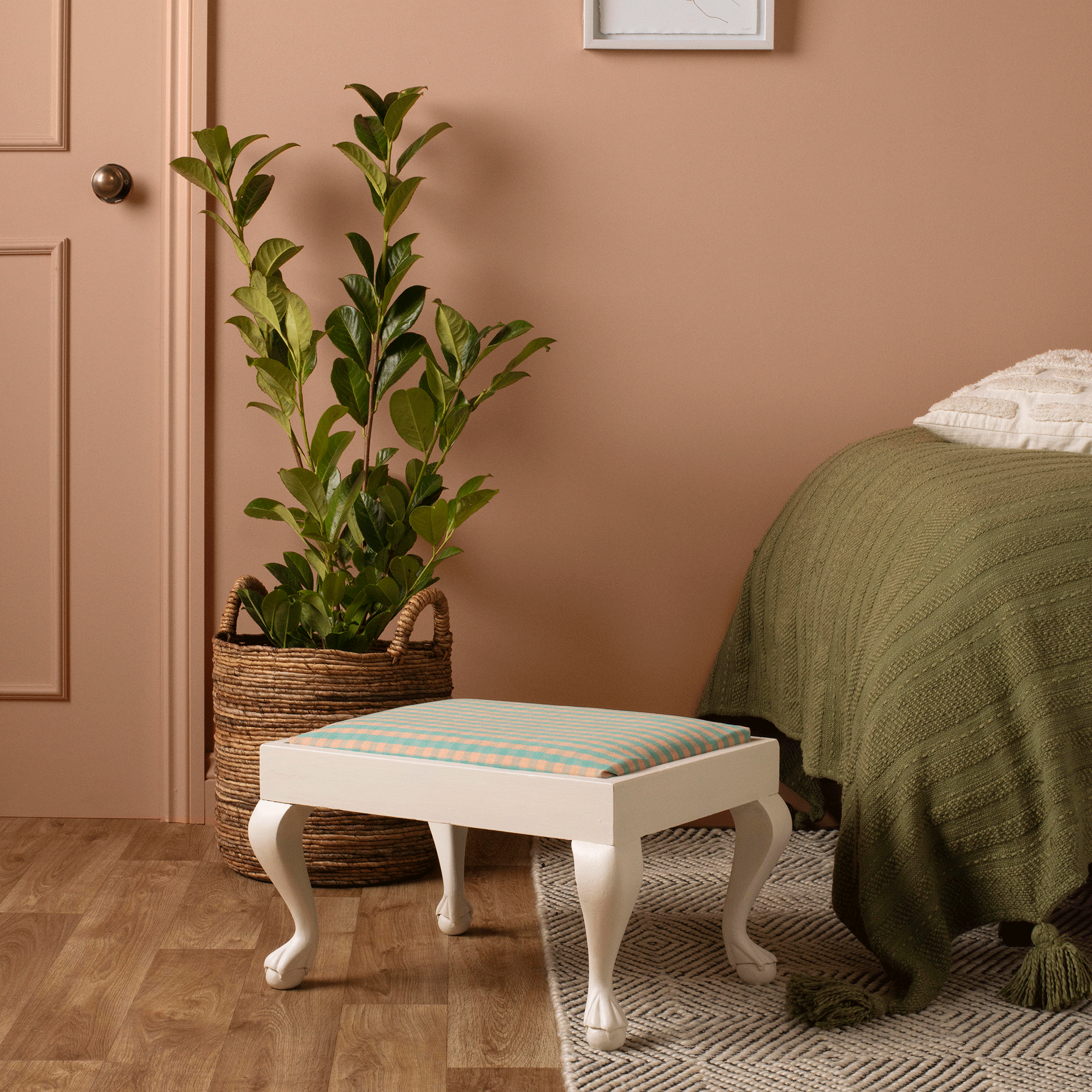 White stool in pink room