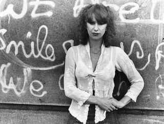 24th May 1976: British actress Helen Mirren leaning against a graffiti-covered wall. (Photo by Evening Standard/Getty Images)