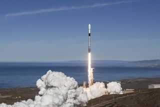 A SpaceX Falcon 9 rocket with a twice-flown first stage launches from Vandenberg Air Force Base in California on Dec. 3, 2018, carrying 64 satellites to orbit on the SSO-A: Smallsat Express mission.