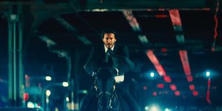 Keanu Reeves as John Wick riding a horse