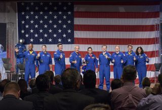 NASA has unveiled the first astronaut crews to fly on private spaceships built by SpaceX and Boeing. The astronauts are: (from left to right) Victor Glover, Mike Hopkins, Bob Behnken, Doug Hurley, Nicole Aunapu Mann, Chris Ferguson of Boeing, Eric Boe, Josh Cassada and Sunita Williams.