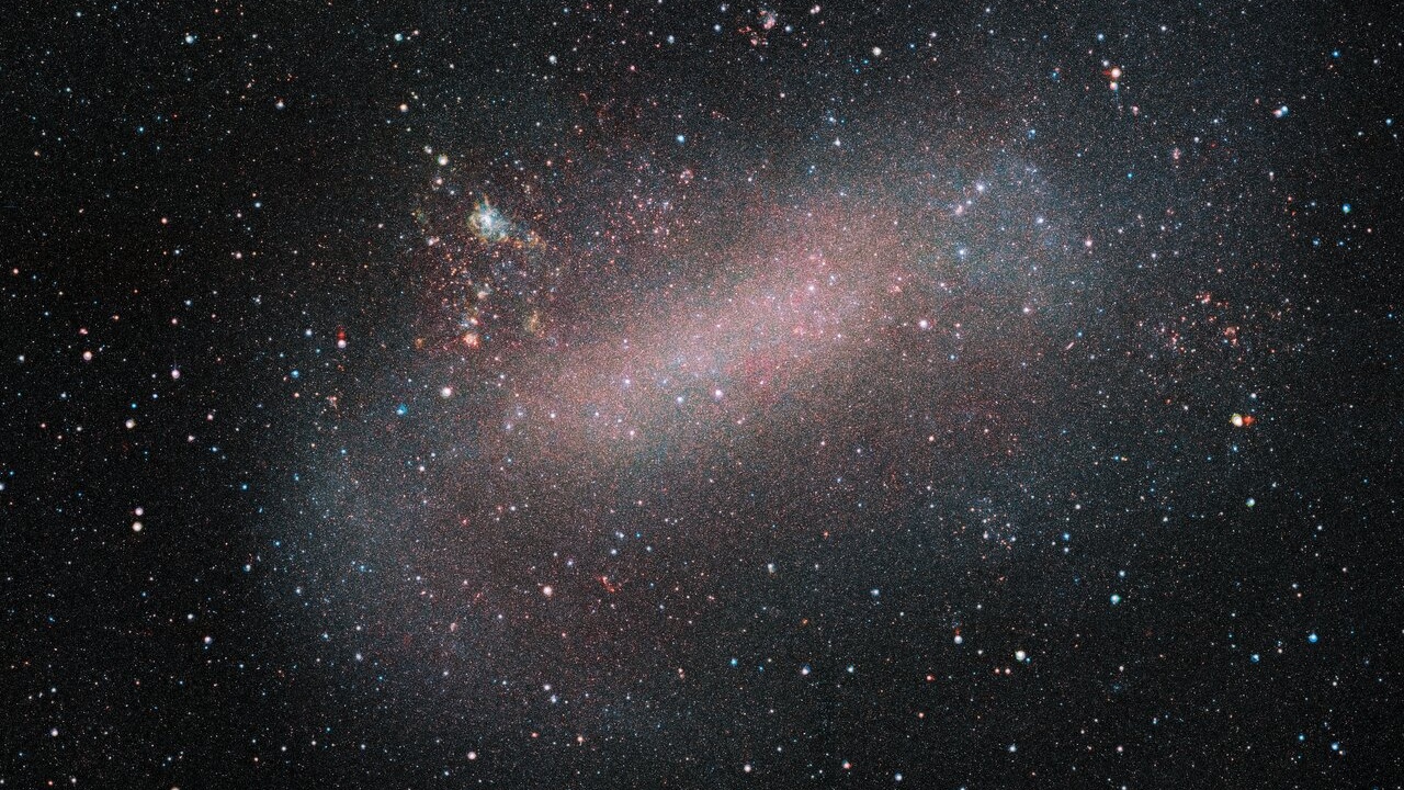 A photo of the LMC, it looks like a bundle of tiny stars against the background of space. 