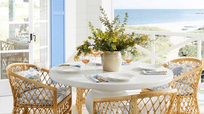 outdoor dining table with vase of flowers