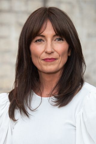 Davina McCall smiling with brunette bob with V fringe