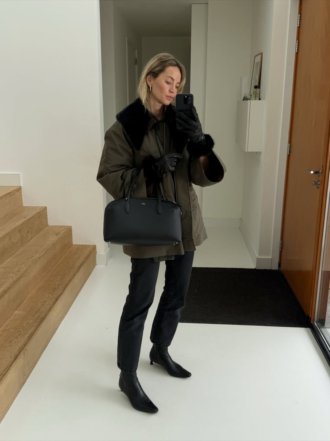 anoukyve wears khaki wax jacket black jeans