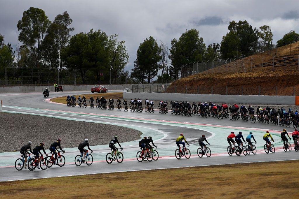 BARCELONA SPAIN AUGUST 27 A general view of the peloton passing through the F1 Circuit de BarcelonaCatalunya during the 78th Tour of Spain 2023 Stage 2 a 1818km stage from Matar to Barcelona UCIWT on August 27 2023 in Barcelona Spain Photo by Tim de WaeleGetty Images