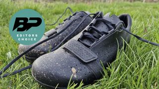 Rapha Explore shoes in a grassy field