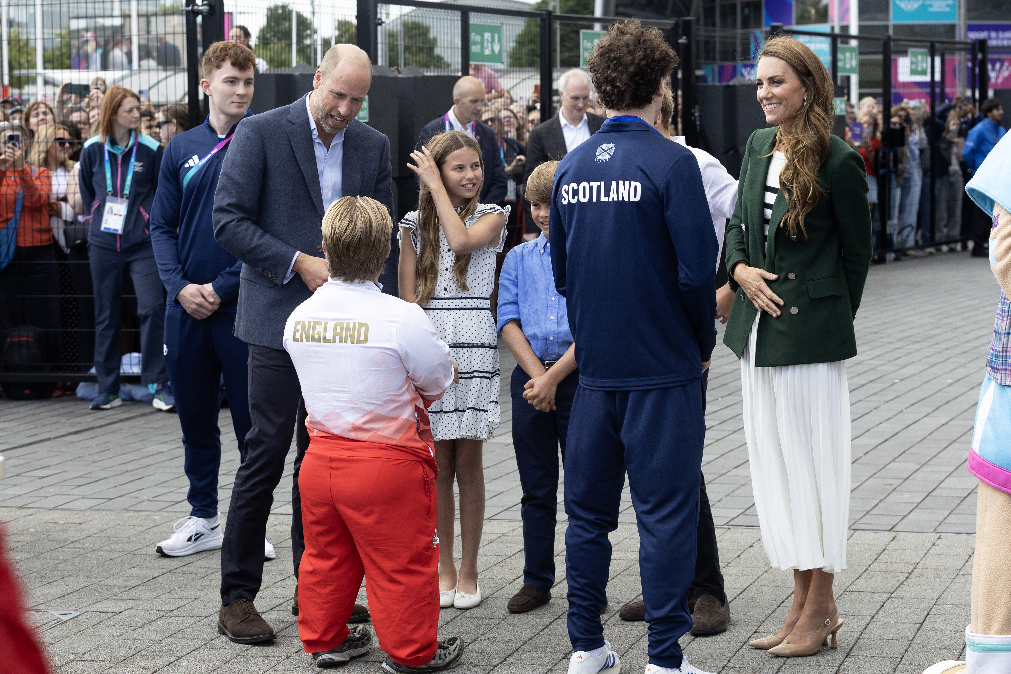 Prince William, Princess Charlotte, Prince Louis, Princess Kate talking to athletes from England and Scotland at the Commonwealth Games