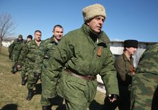 UN envoy to Crimea ends early after armed men stop representative