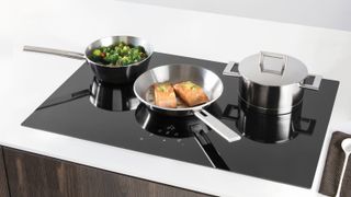 large induction hob with food cooking