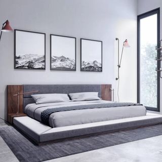 Amalie Upholstered Platform Bed Frame on gray carpet.