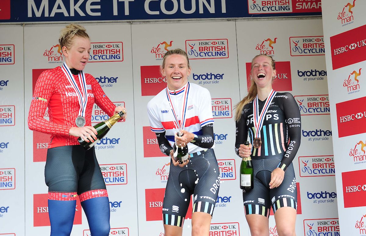 After a lot of hard work, Anna Christian sprays the champagne