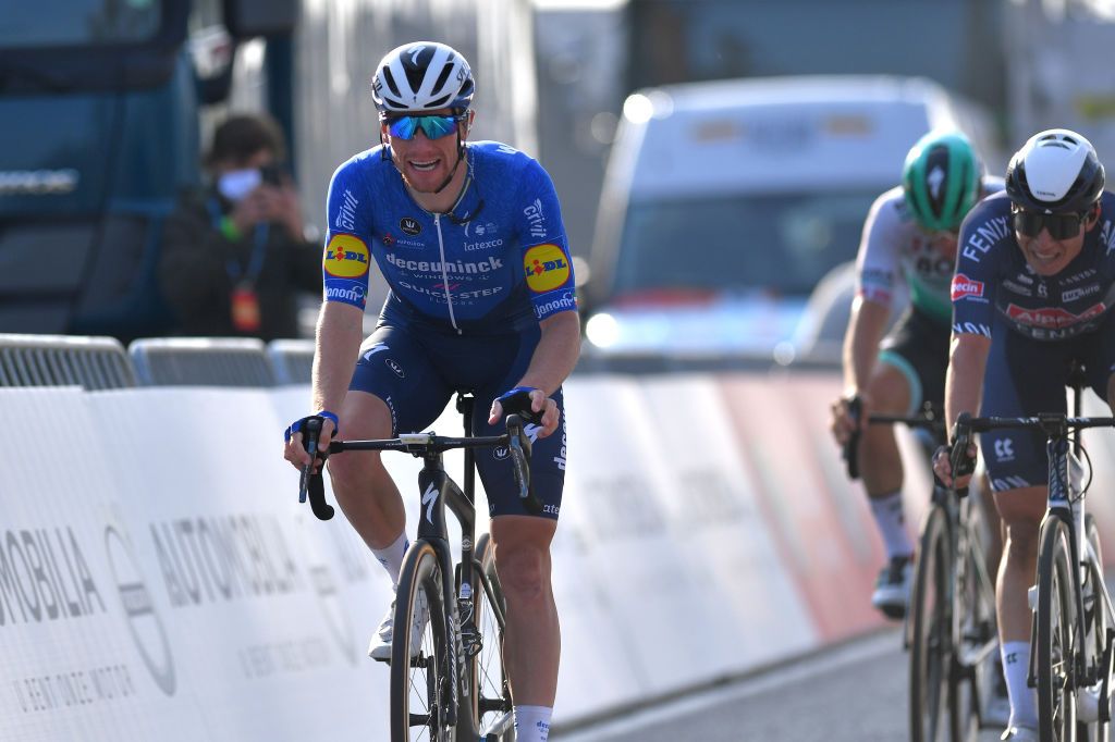 DE PANNE BELGIUM MARCH 24 Arrival Sam Bennett of Ireland and Team Deceuninck QuickStep Celebration Jasper Philipsen of Belgium and Team AlpecinFenix during the 45th Oxyclean Brugge De Panne 2021 Men Classic a 2039km race from Brugge to De Panne OxycleanClassic on March 24 2021 in De Panne Belgium Photo by Luc ClaessenGetty Images