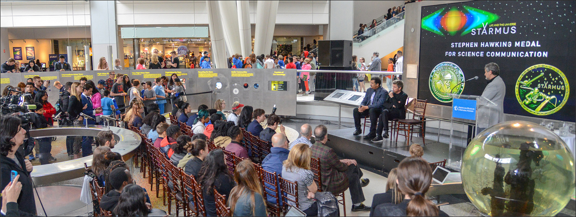 Crowds gathered at the Rose Center for Earth and Space in the American Museum of Natural History for the announcement that Neil deGrasse Tyson and Jean-Michel Jarre will receive this year's Stephen Hawking Medal for Science Communication.