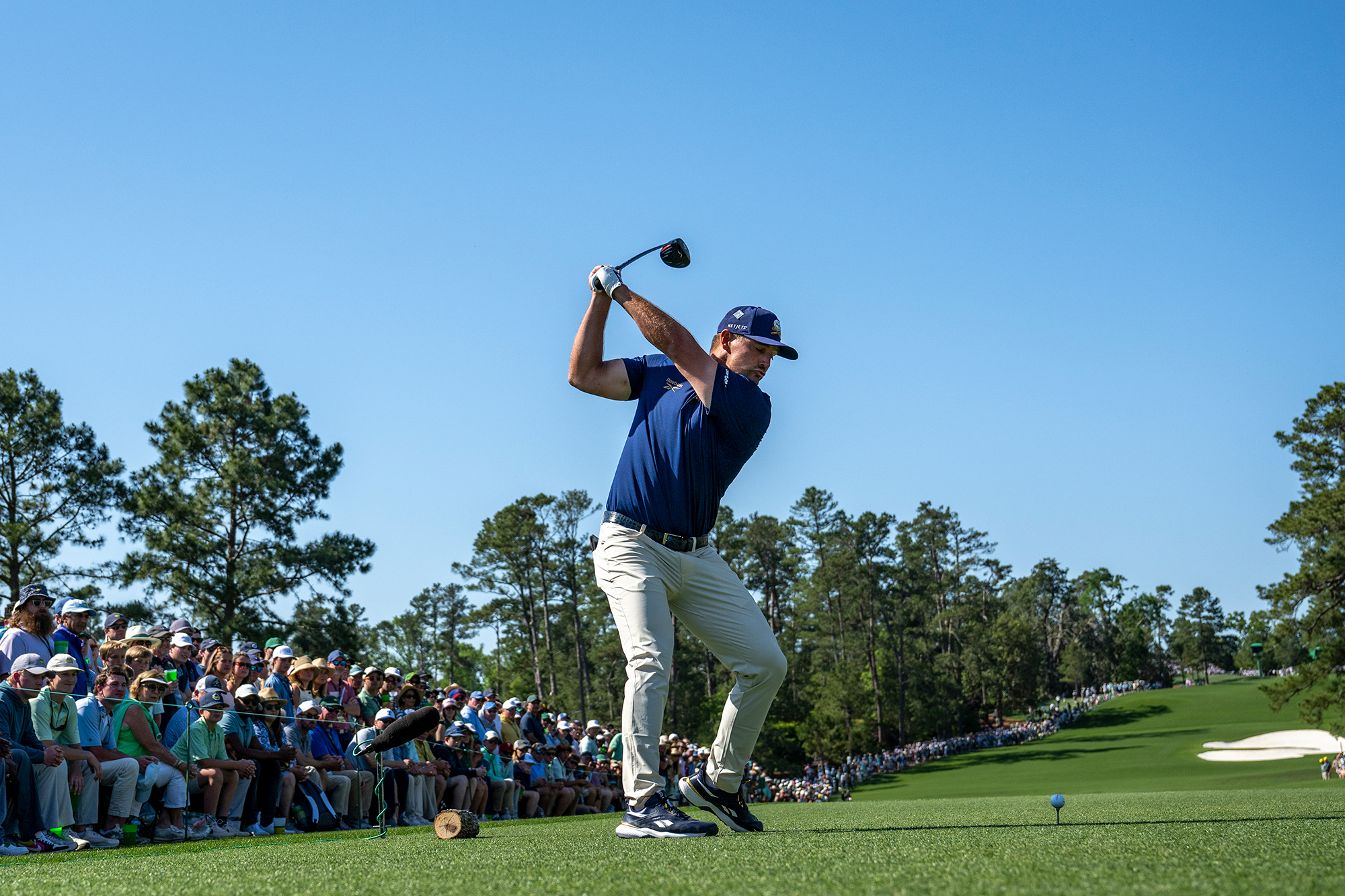 Bryson DeChambeau at the top of backswing about to hit a driver down the 8th hole at Augusta National during the Masters in 2025