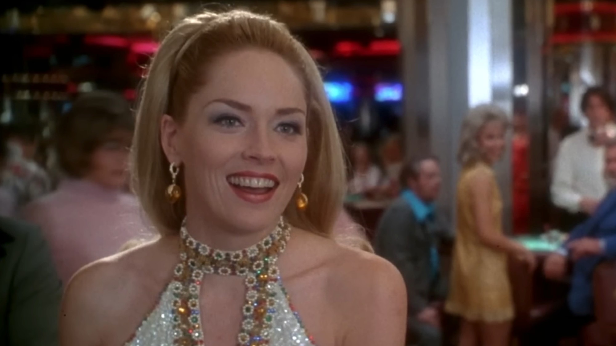 A close up with Sharon Stone in a white top, smiling, in Casino
