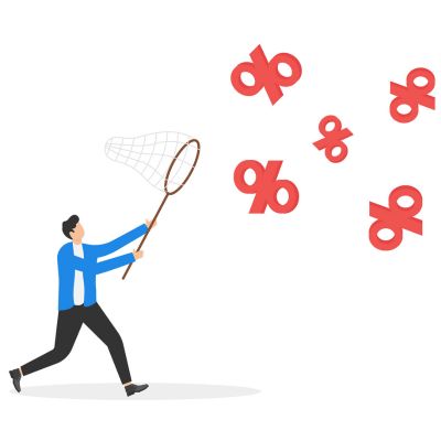 A man trying to catch percentage signs with a net.