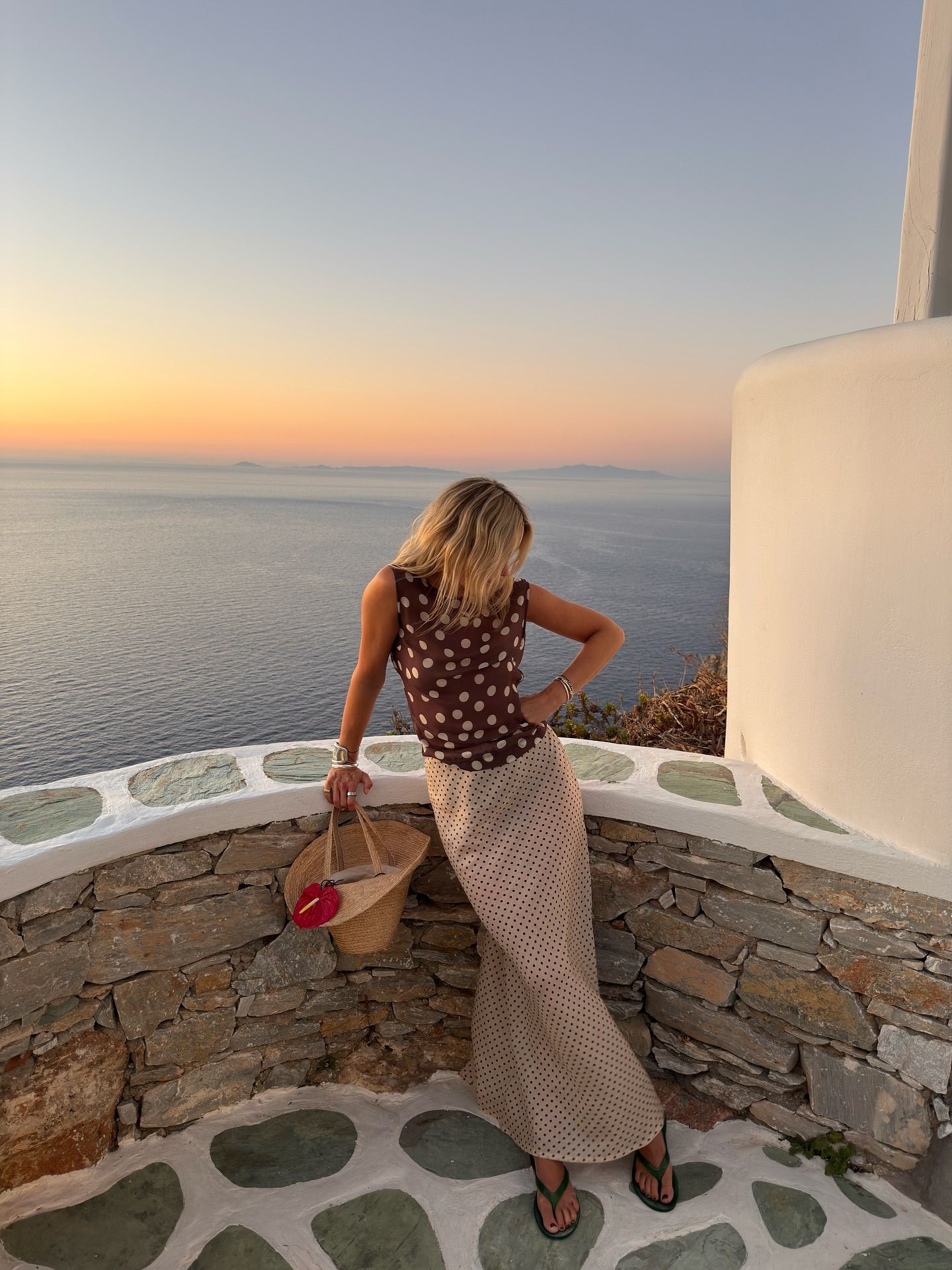 An image of @lucywilliams02 wearing one of the key sleeveless top trends.