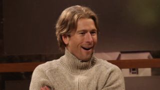 Glen Powell in SNL Norwegian movie set sketch smiling.
