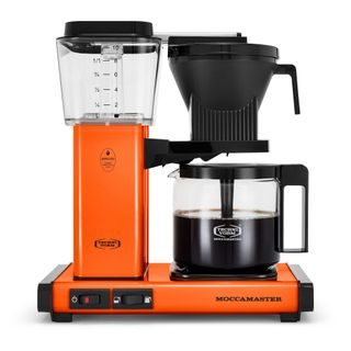 A Moccamaster by Technivorm KBGV Select in orange making coffee