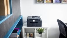 Brother MFC-J4550DW inkjet printer pictured on a desk in a home office.