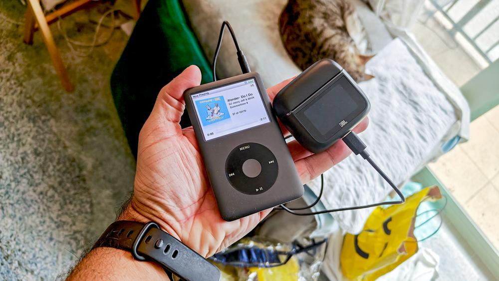 JBL Tour Pro 3 next to iPod