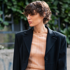 woman wearing striped tee and a blazer 