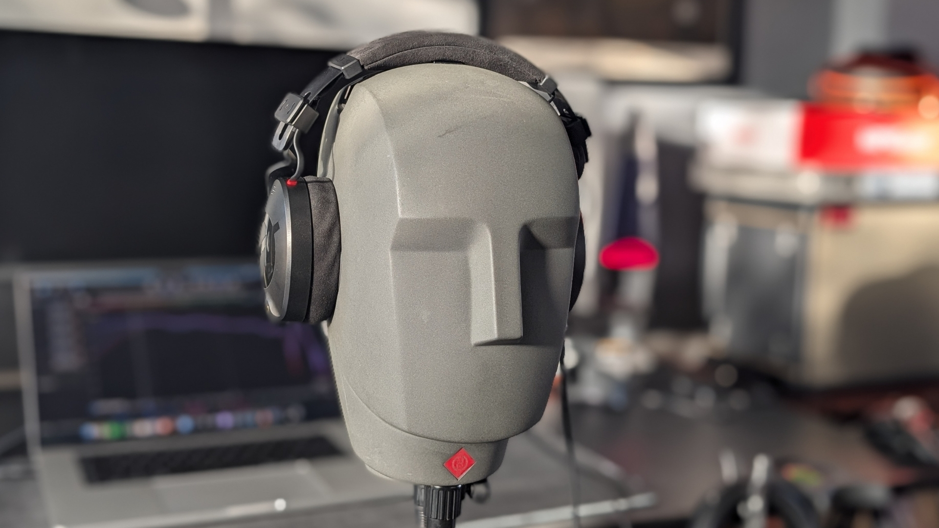 A pair of Rode NTH-100 studio headphones on a Neumann KU 100 dummy head