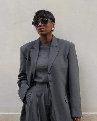 Loicka Grace wears a suit