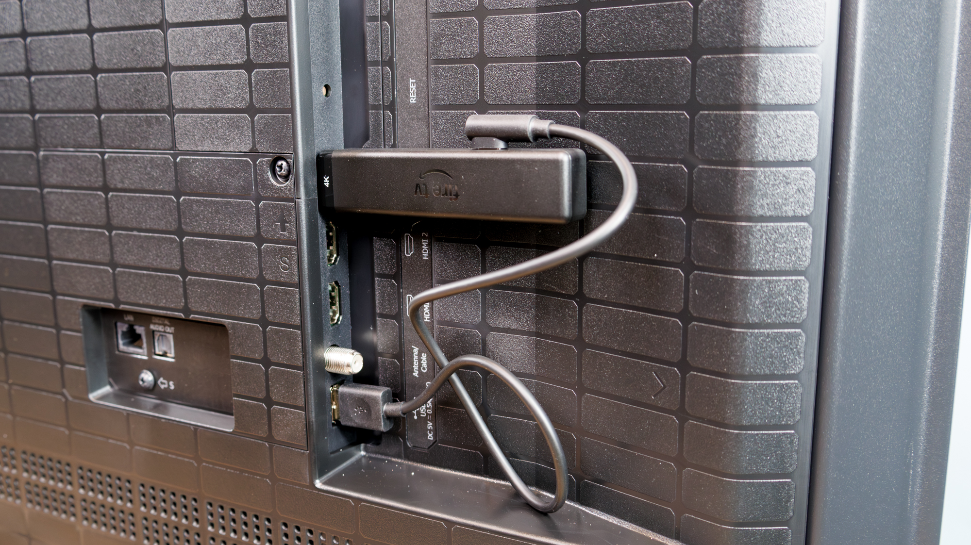 Amazon Fire TV Stick 4K plugged into TV