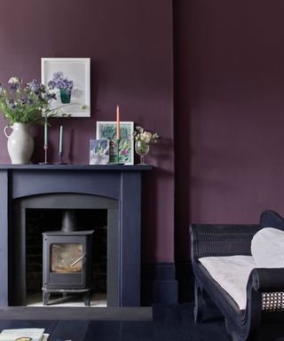 living room with purple wall, dark navy floor and fireplace