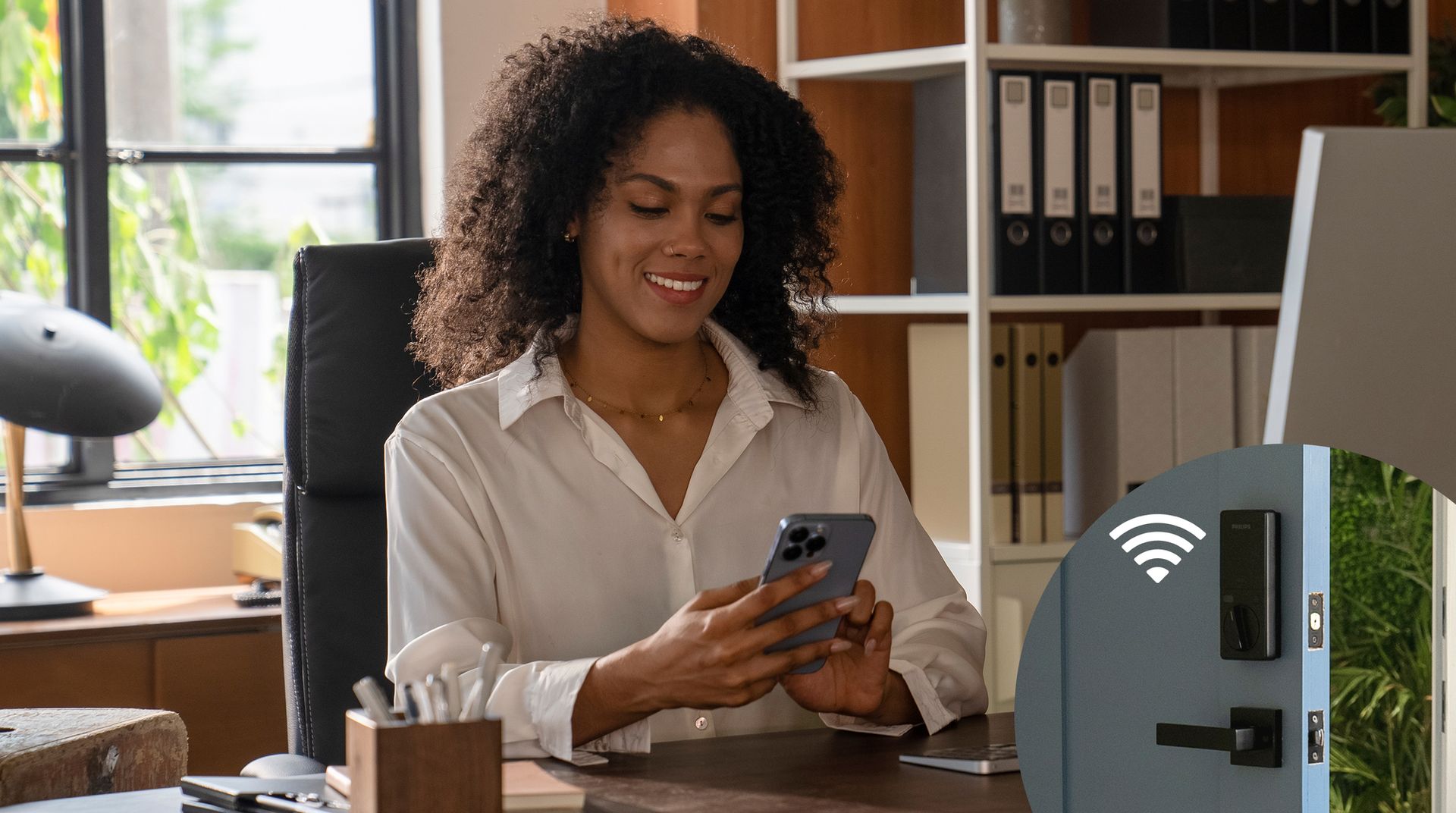 A woman using her phone to access her smart lock