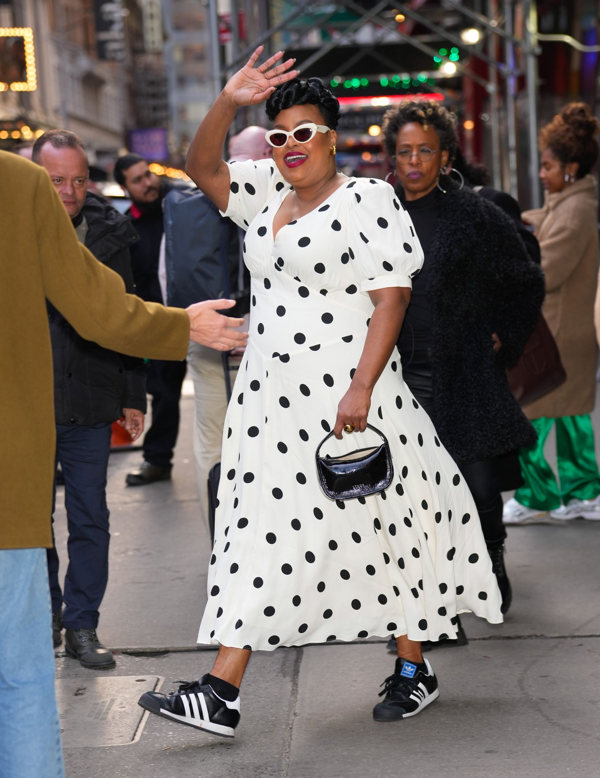 Natasha Rothwell wears black and white trainers.