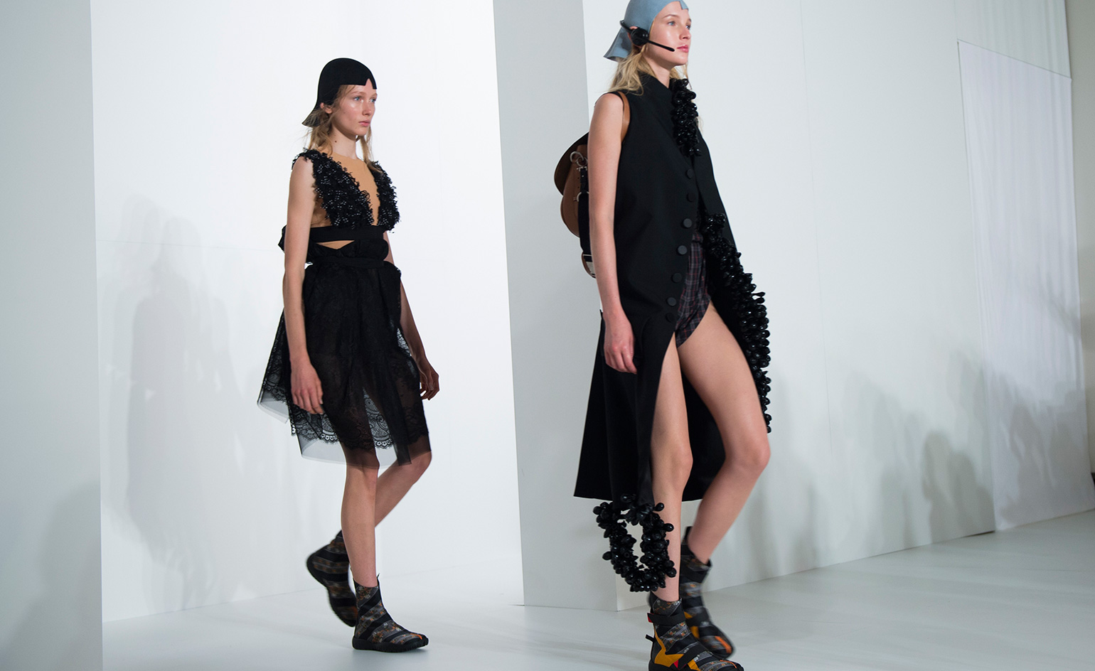 Models are wearing egg shell shaped cap.