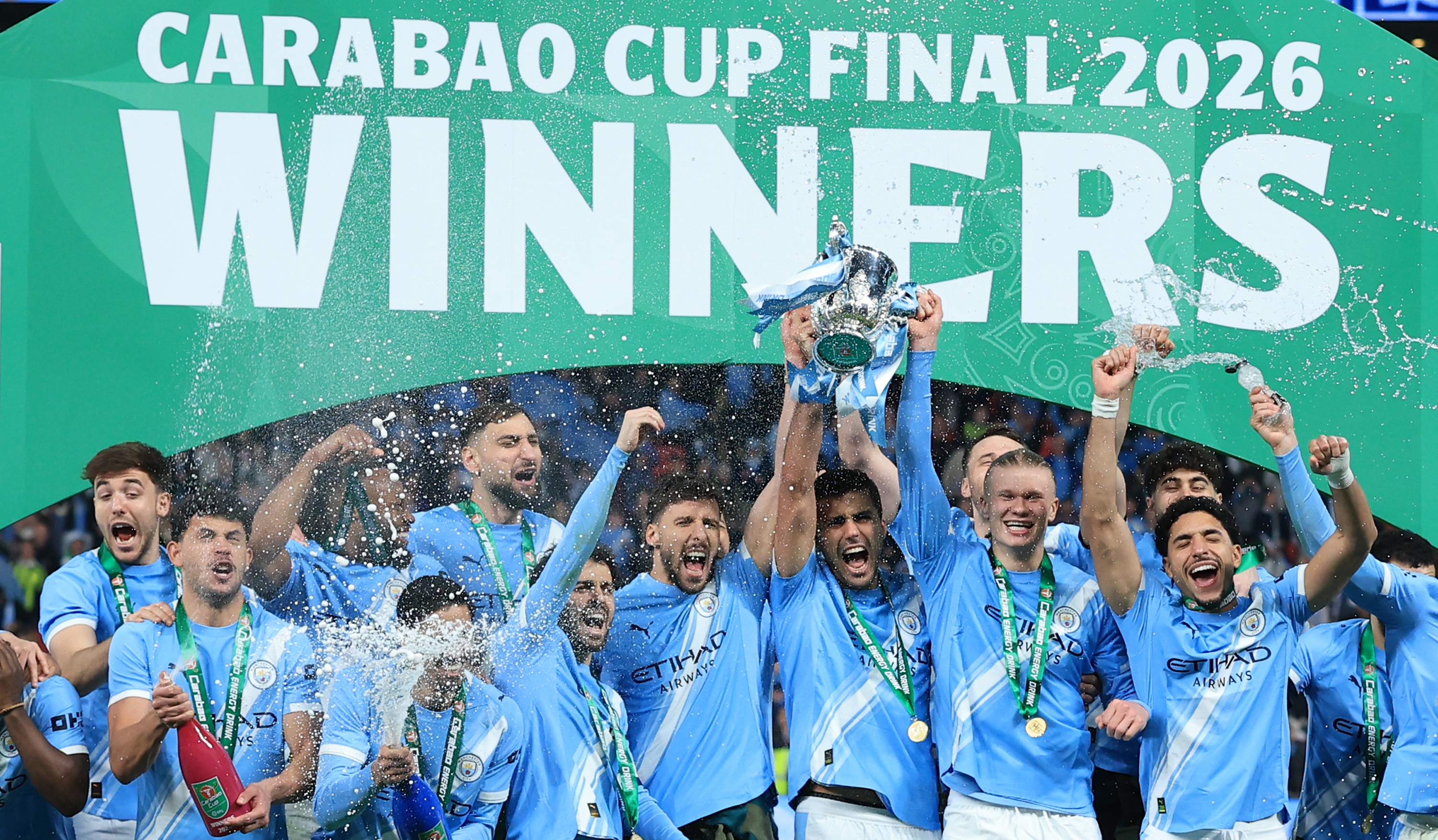 Manchester City players celebrate with EFL Trophy after winning the Carabao Cup Final match between Arsenal and Manchester City at Wembley Stadium on March 22, 2026 in London, England