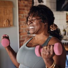 Beginner gym workouts: A woman strength training at home