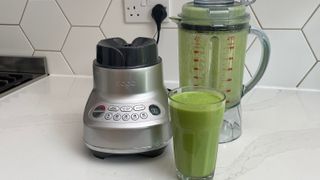 The Breville the Fresh & Furious on a kitchen countertop having been used to make a green smoothie